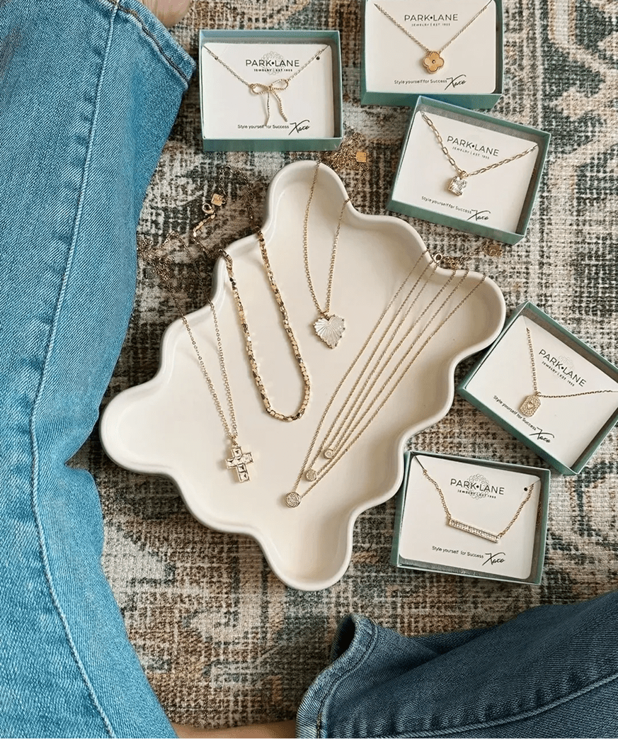 Gold necklaces on decorative tray